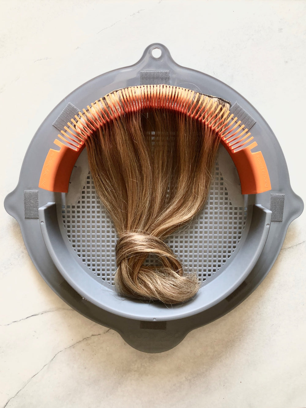 Highlighted hairpiece supported by ProDry Disc styling accessory