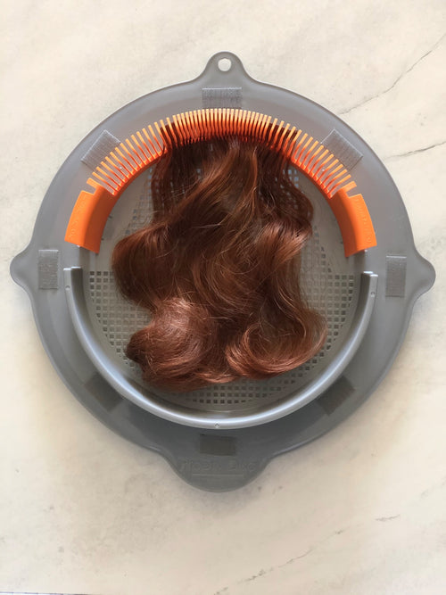 ProDry Disc styling accessory supporting a hairpiece
